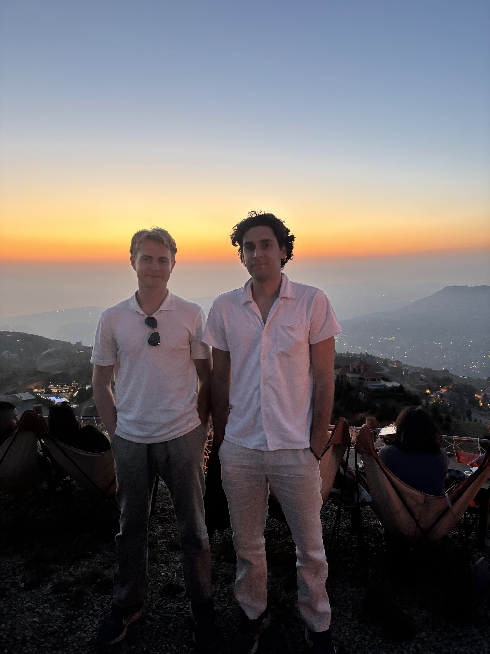 David and Nima on a desert ridge at golden hour