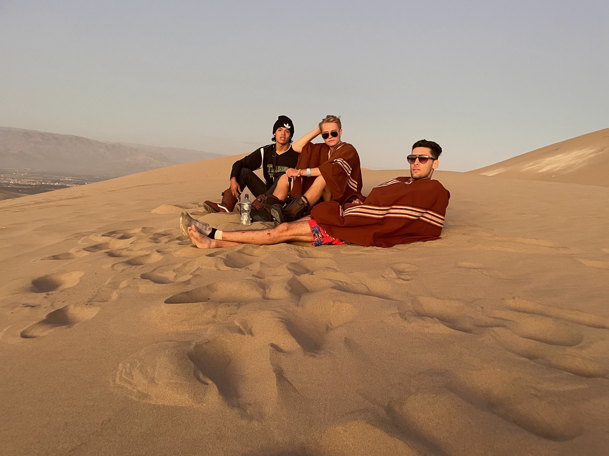 David and Nima on a desert ridge at golden hour