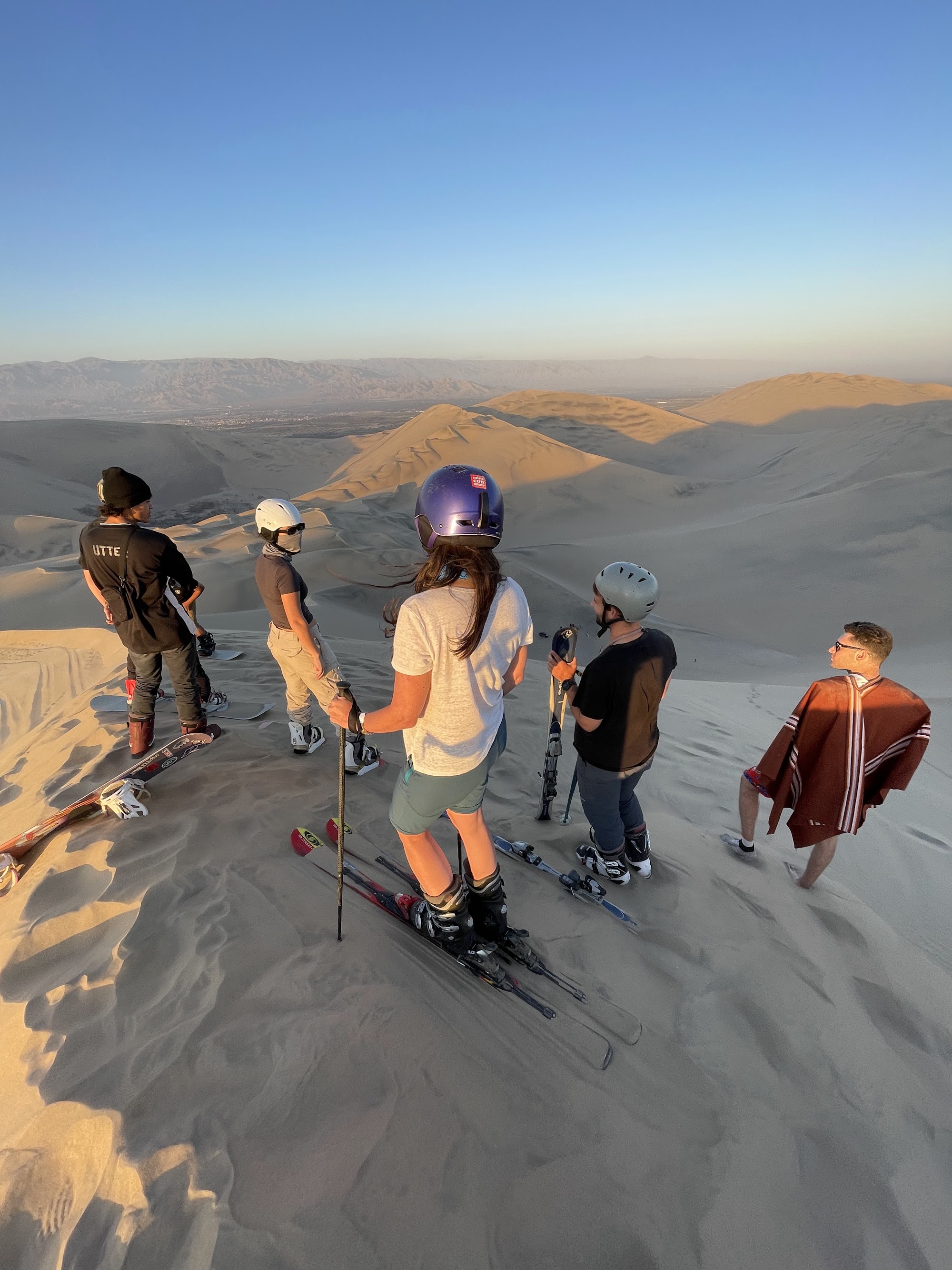 David and Nima on a desert ridge at golden hour