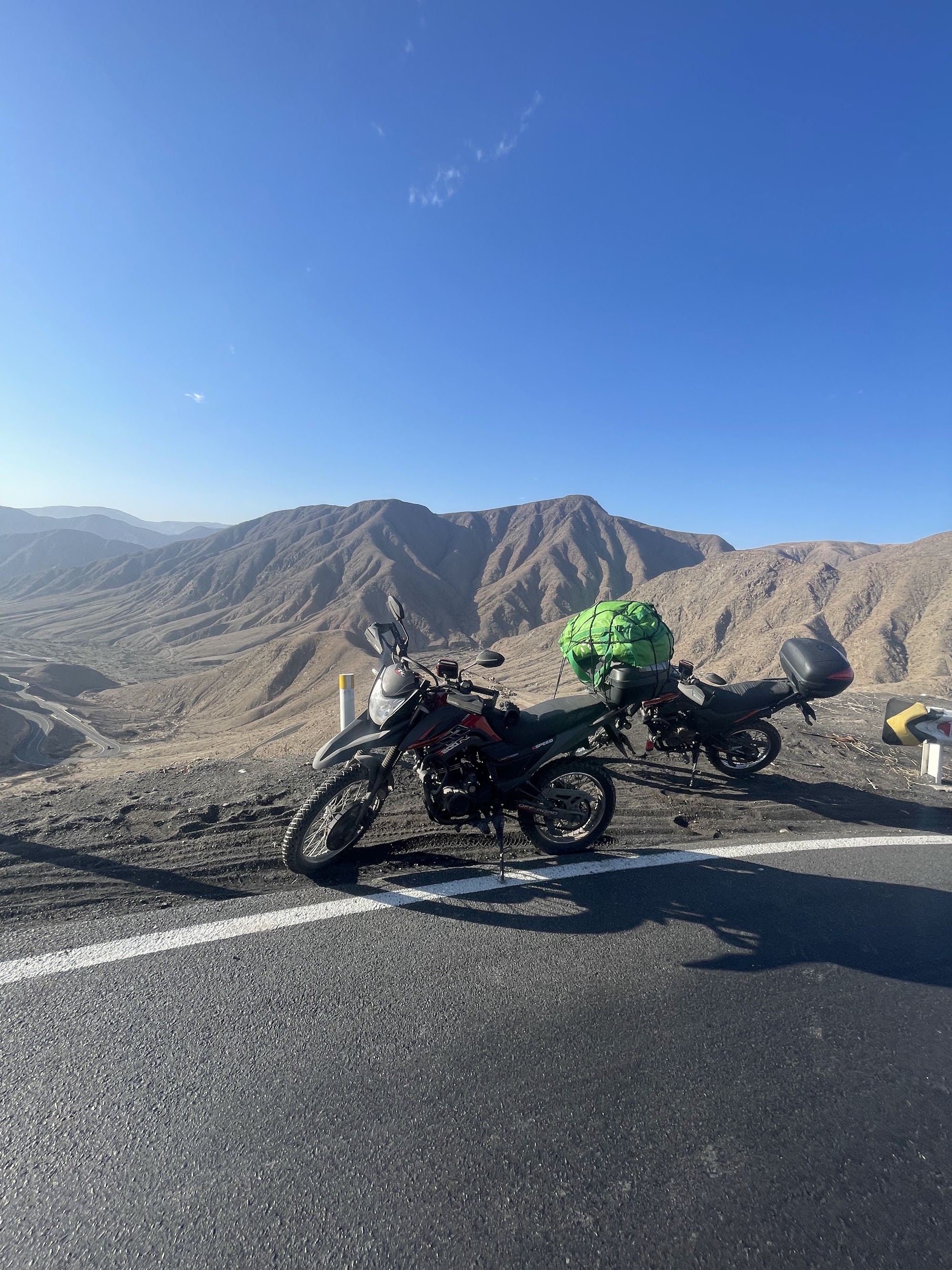 David and Nima on a desert ridge at golden hour